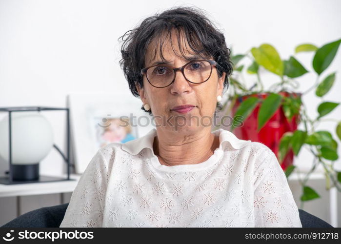 a portrait of a beautiful mature woman at home