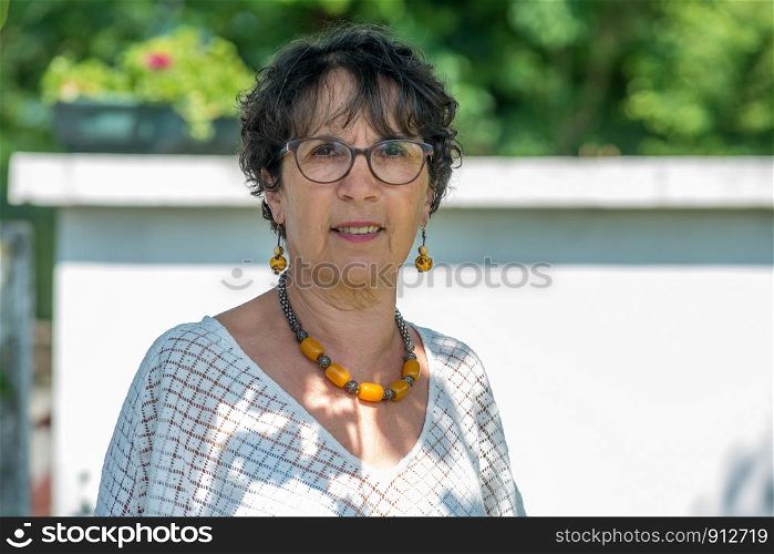 a portrait of a beautiful mature woman in the garden