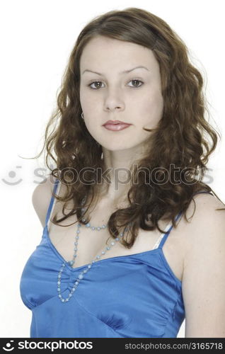 A portrait of a beautiful young model in a blue top