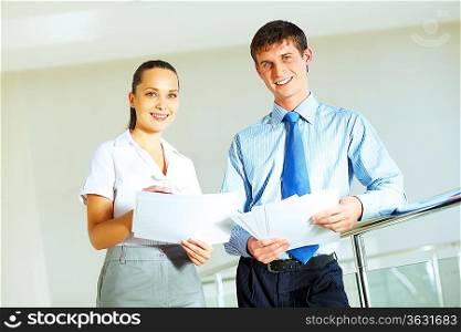 A portrait of a businesswoman and a businessman working together as a team im the office
