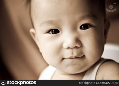 A portrait of a cute asian baby