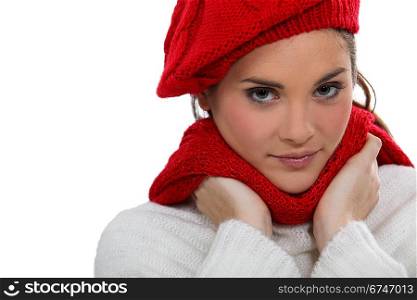 A portrait of a cute brunette in winter clothes.