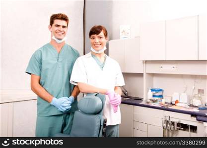 A portrait of a dentist and an assistant