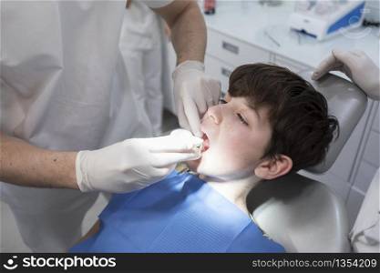 A portrait of a dentist working