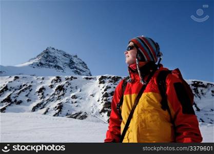 A portrait of a female adventurer against a mountain landscape
