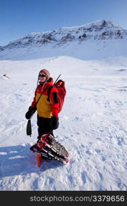 A portrait of a female adventurer against a mountain landscape