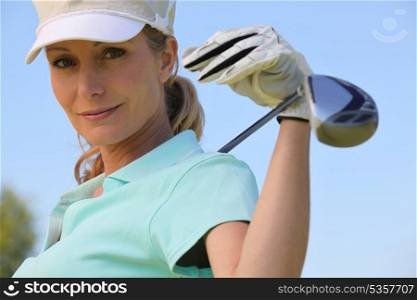 A portrait of a female golfer.