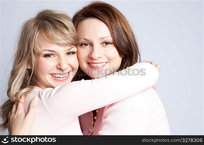 A portrait of a happy mother and daughter