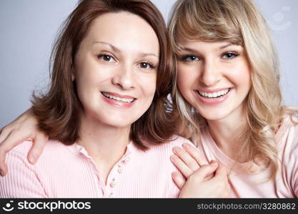 A portrait of a happy mother and daughter