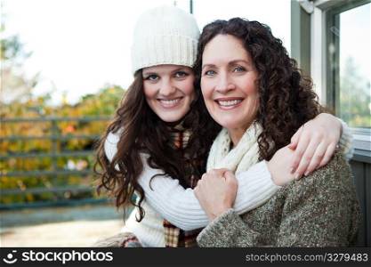 A portrait of a happy mother and daughter outdoor