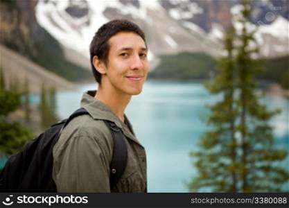 A portrait of a man outdoors on a hiking trip