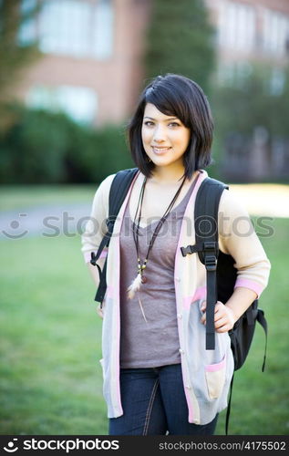 A portrait of a mixed race college student at campus