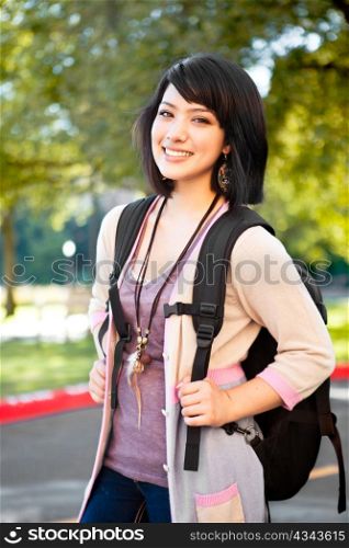 A portrait of a mixed race college student at campus