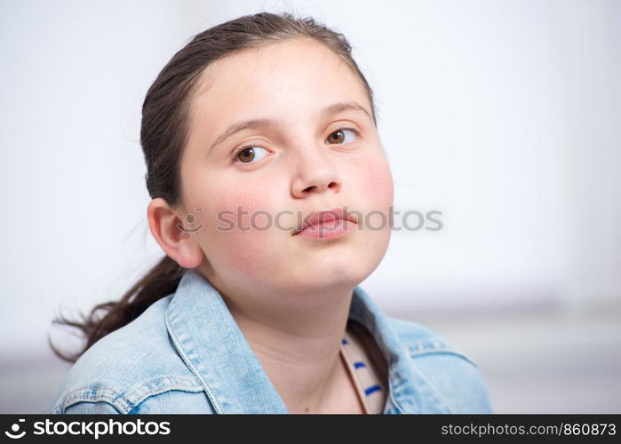 a portrait of a teenager with a jeans jacket