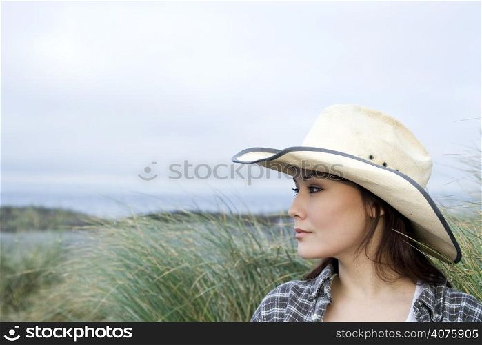 A portrait of a young beautiful woman at the beach