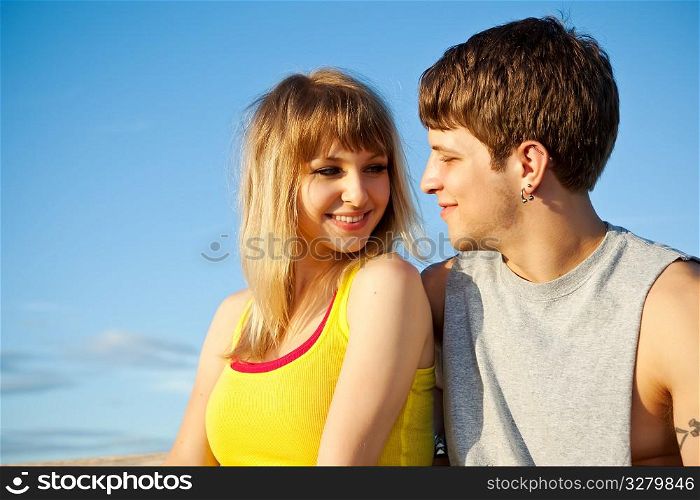 A portrait of a young caucasian couple in love outdoor