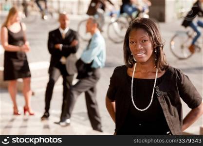 A portrait of an African American business woman outdoors