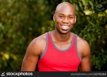 A portrait of an african american man taking a break from exercising
