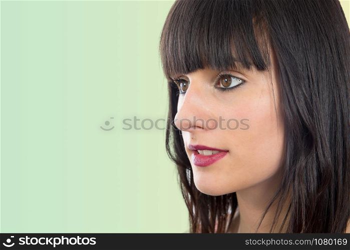 a portrait of beautiful brunette girl, side view