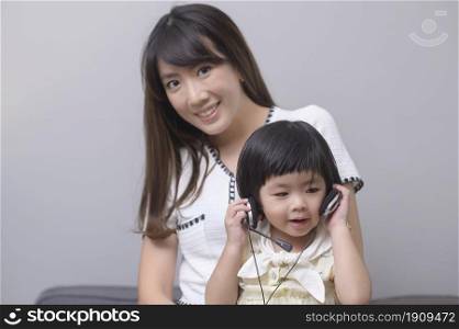 A portrait of happy asian mom and daughter . Portrait of happy asian mom and daughter