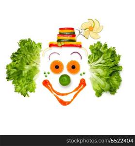 A portrait of joyful clown made of vegetables and sauce.