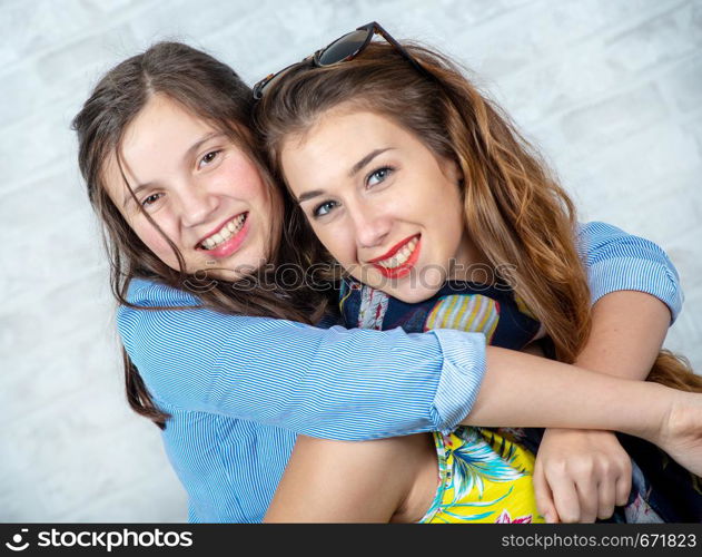 a portrait of pretty beautiful charming adorable with long hair girl and her older friend