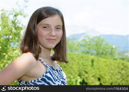 a portrait of pretty beautiful young teenager, outdoors