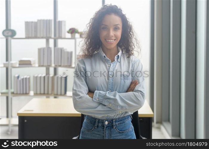 A portrait of young african businesswoman smiling in modern office. Portrait of young african businesswoman smiling in modern office