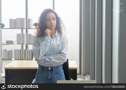 A portrait of young african businesswoman smiling in modern office. Portrait of young african businesswoman smiling in modern office