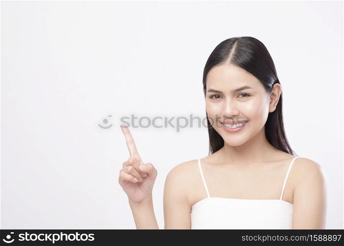 A portrait of young beautiful woman with smooth healthy skin on white background , Skincare concept . Portrait of young beautiful woman with smooth healthy skin on white background , Skincare concept