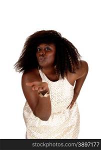 A portrait picture of a big African American woman in a beige dress blowing a kiss, isolated for white background.