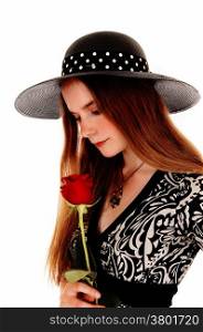 A portrait picture of a pretty woman holding a red rose and wearing anice hat, isolated for white background.