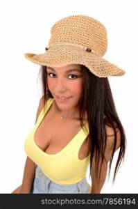 A portrait picture of a teenager girl wearing a yellow t-shirt an a straw hat,standing isolated for white background.