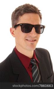 A portrait picture of a young business man in a suit and tie, wearing darksunglasses and smiling, isolated for white background.