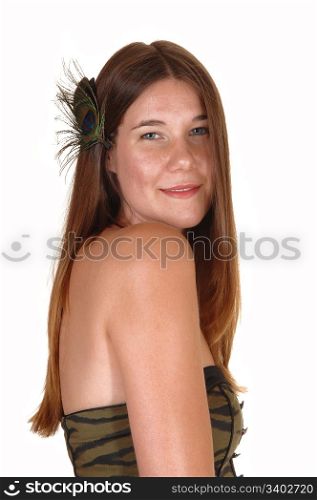 A portrait shot in profile of a pretty teenage girl with long dark blond hairand with a feather in her hair, for white background.
