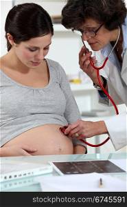 A pregnant woman at her gynaecologist.