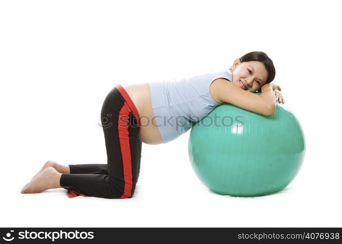 A pregnant woman doing relaxation with birth ball