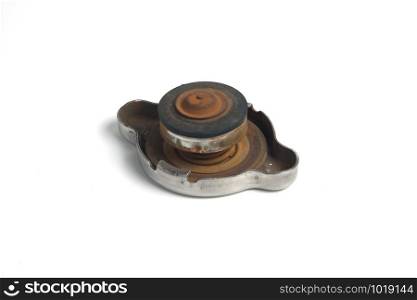 A pressure cap of the car radiator rust condition on the surface. because the status inside has expired, selective focus with white background.