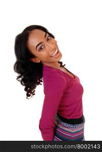 A pretty African American woman in a burgundy sweater and striped skirtstanding in profile, isolated for white background.