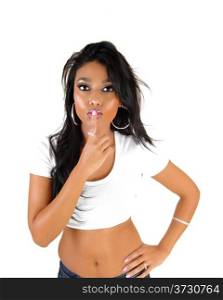 A pretty Asian woman with long black hair holding her finger over her mouthto blow a kiss, for white background.