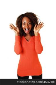 A pretty black teenager girl is very supriced, holding her hands on her&#xA;face and mouths open, in orange sweater for white background.&#xA;
