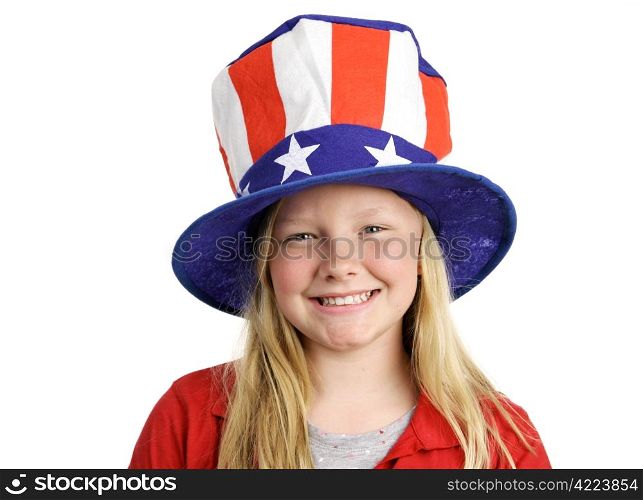 A pretty blond little girl smiling in a stars and stripes hat for Fourth of July. Isolated on white.