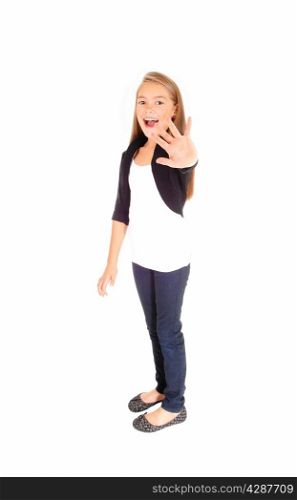 A pretty eight year old girl holding her hand up smiling, and sayingNO, isolated on white background.