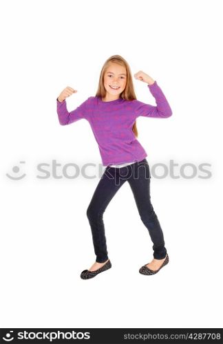 A pretty eight year old girl in jeans and a sweater dancing, isolatedon white background.