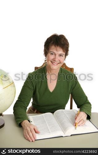 A pretty librarian at her desk doing research. Isolated on white.Note for inspector: Texture of velour sweater may resemble artifacting.