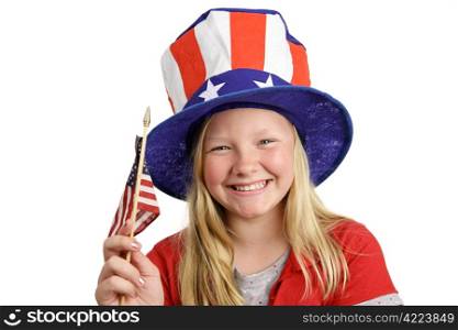 A pretty little girl in a patriotic hat waving an American flag. Isolated on white.