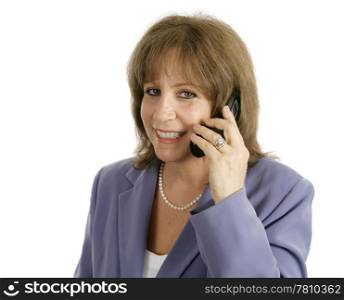 A pretty, mature business woman smiling as she talks on her cellphone. Isolated with room for text.