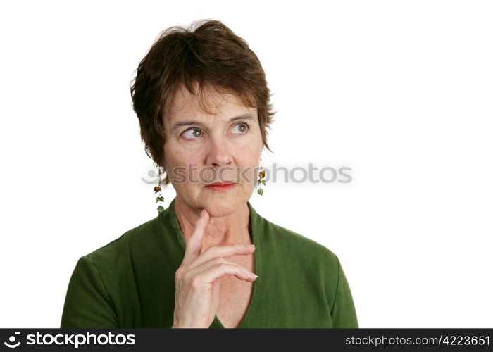 A pretty, mature Irish woman lost in thought. Isolated on white.
