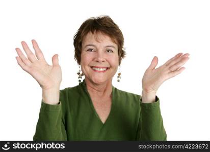 A pretty, middle aged Irish woman throwing her hands up and smiling. Could be excitement or worship. Isolated on white.