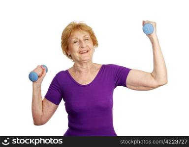 A pretty senior woman smiling as she lifts freeweights. Isolated on white.